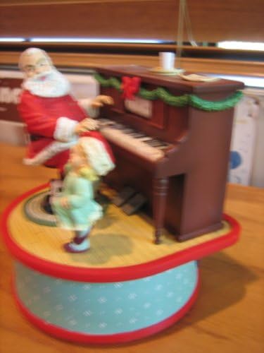 Musical Santa Claus ----- cântă „The Entertainter”